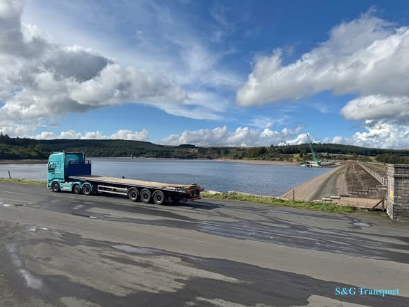 Flatbed transport beside water