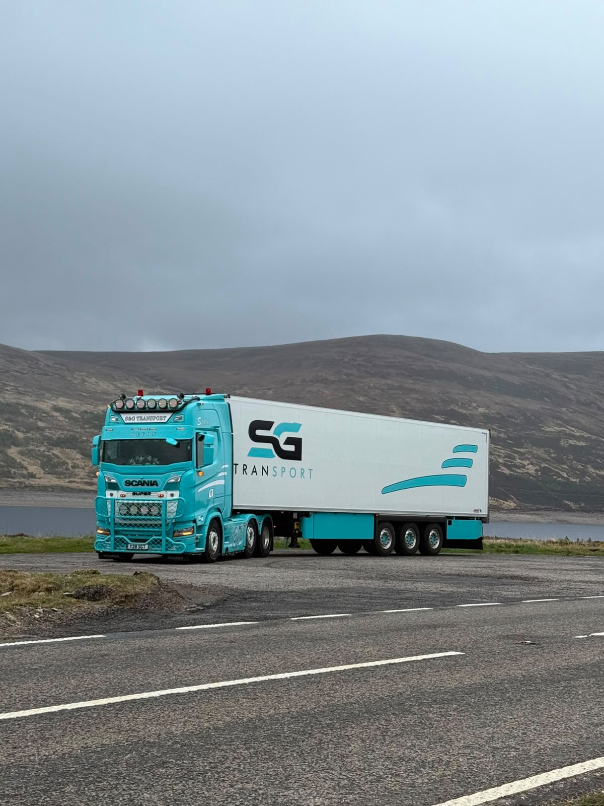 S&G Transport lorry on a scenic route