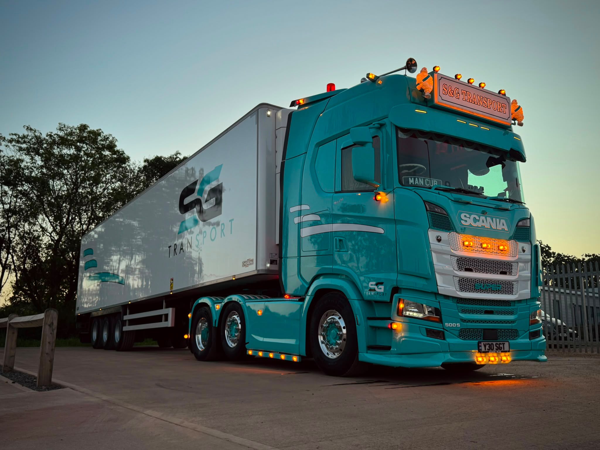S&G Transport curtain-sided vehicle parked in the evening